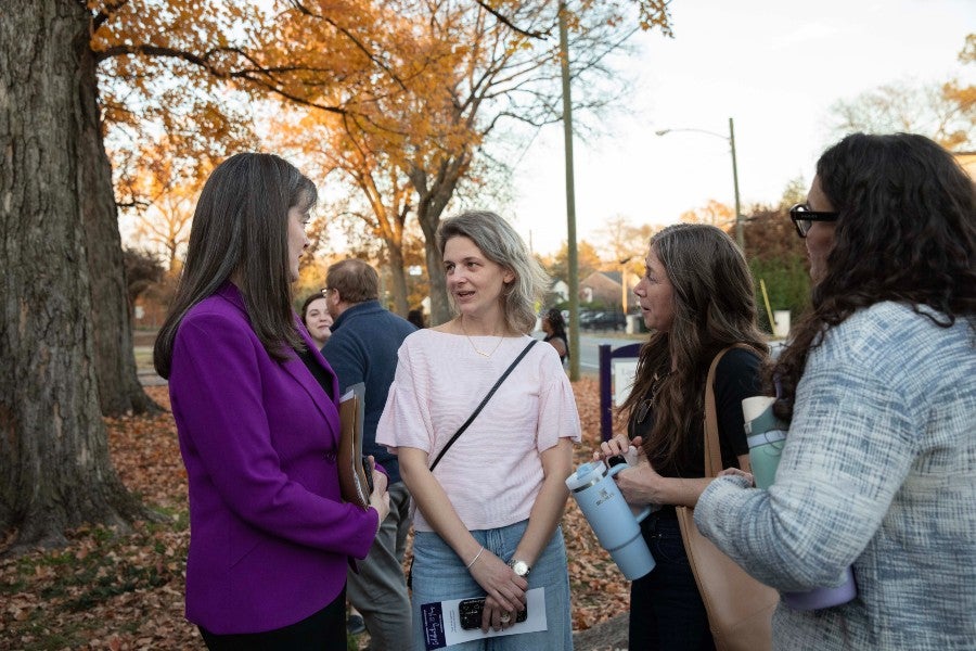 Lipscomb president Candice McQueen talking with alums at the reunion