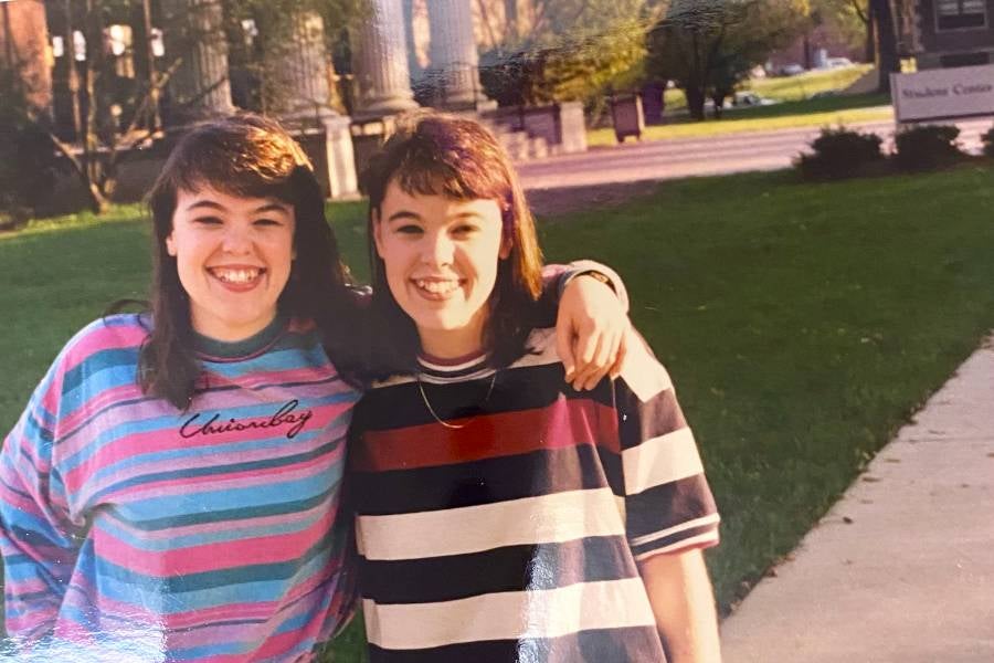 Trevathan, right, with twin sister, Jenny (Oliver) Estes, in Bison Square over 30 years ago. 