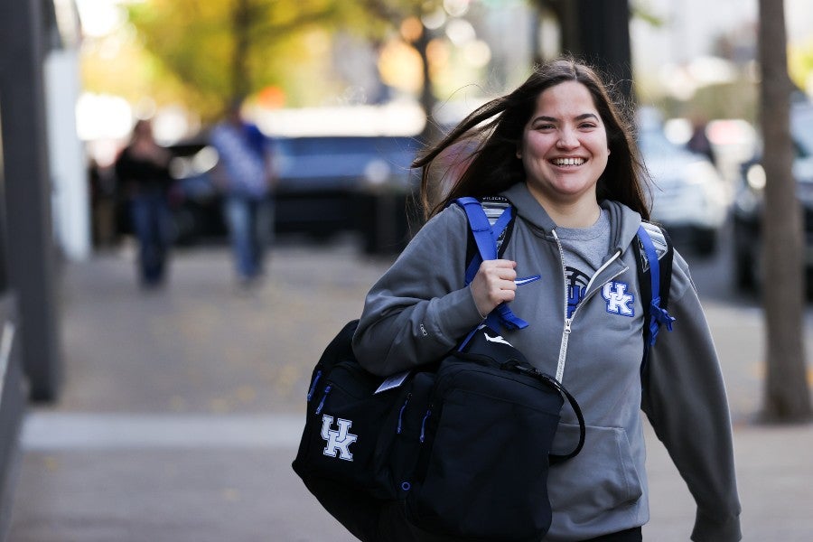 Xaymara Gonzalez-Adams walking on campus in her UK gear
