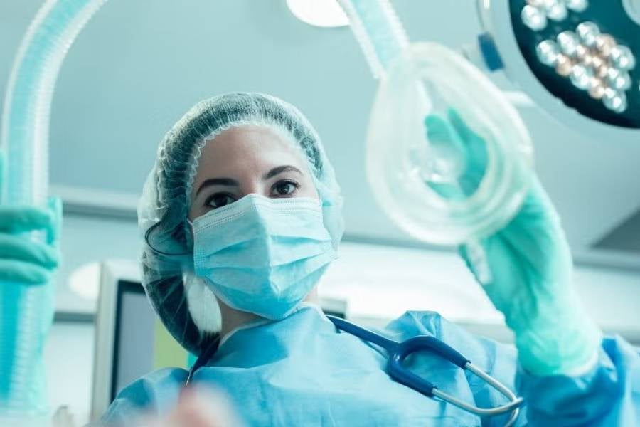 Nurse administering anesthesia. 