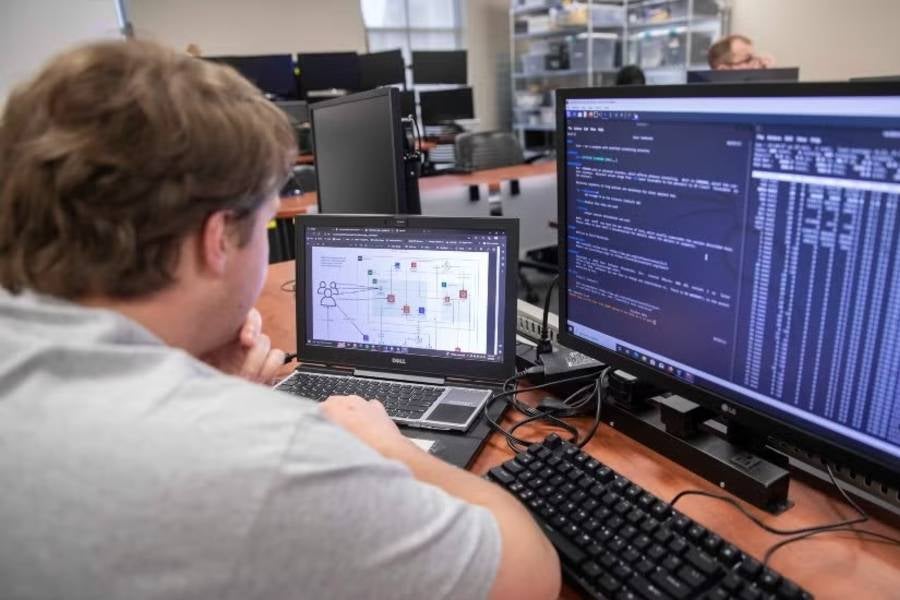Student sitting at computer. 
