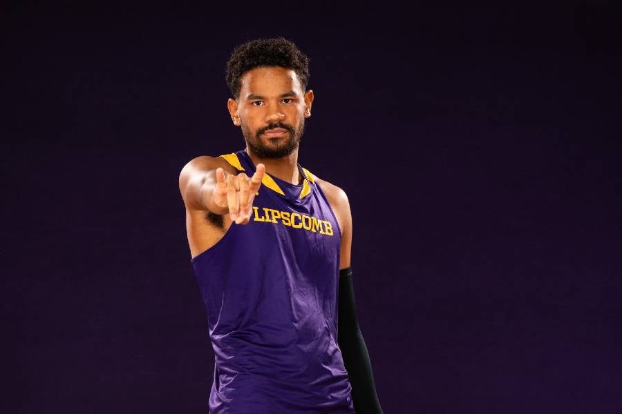 Gabriel Martin doing Bison Horns Up sign toward the camera. 