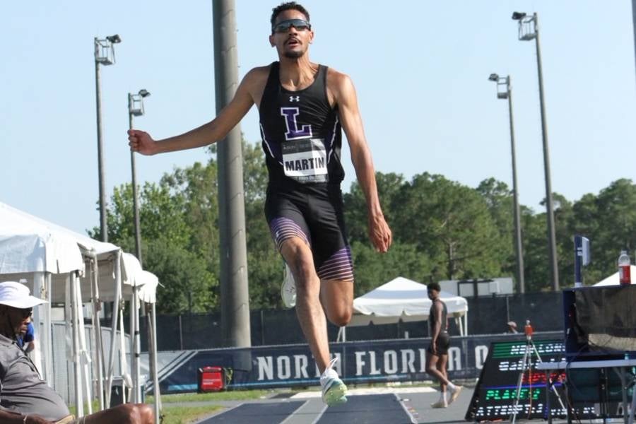 Gabriel Martin competing in the long jump. 
