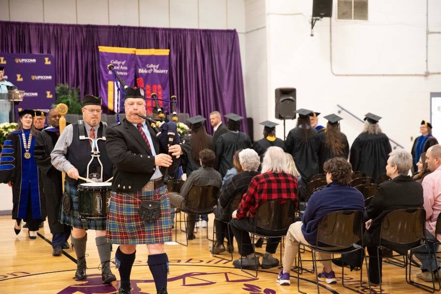 Graduation participants recess out of the ceremony. 
