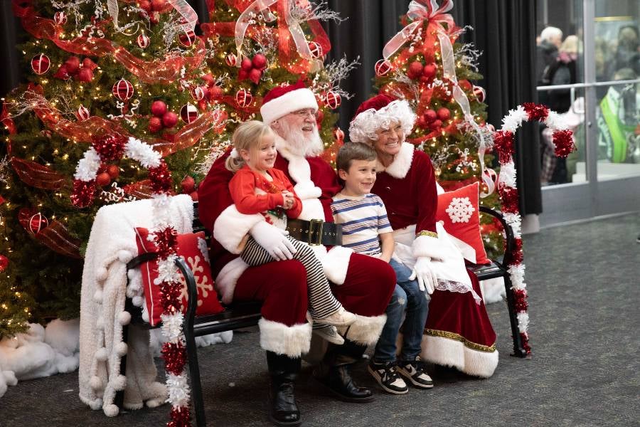 Children sitting in Santa's lap. 