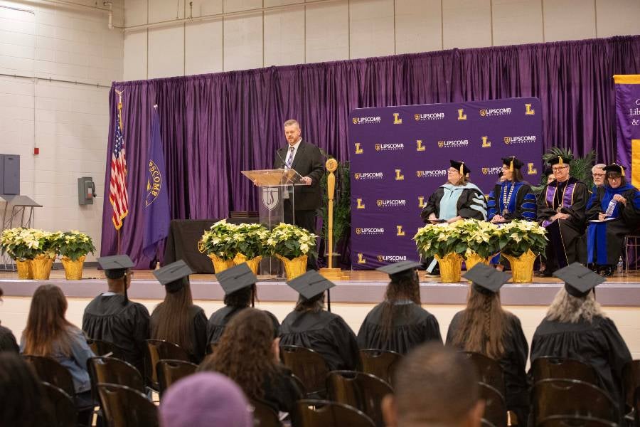 DJRC Warden Jordan Clark addresses the graduates. 