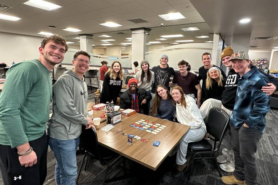 Students playing cards in Bennett Campus Center