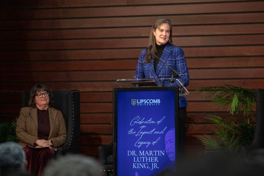 Lipscomb President Candice McQueen standing at a podium at the Celebration of the Life and Legacy of Martin Luther King Jr. 