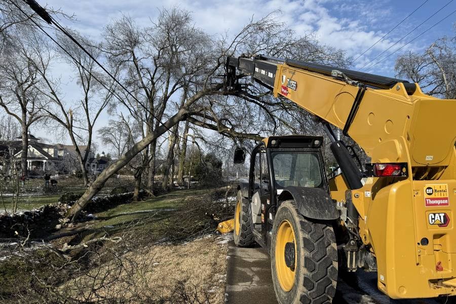 Crews removing trees around campus after the winter storm. 