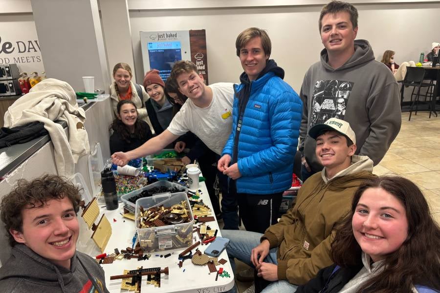 Students in Bennett Campus Center playing with legos during the winter storm. 