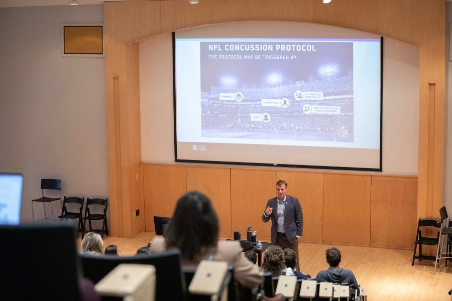 Dr. Allen Sills show the NFL concussion protocol to students in Ward Hall
