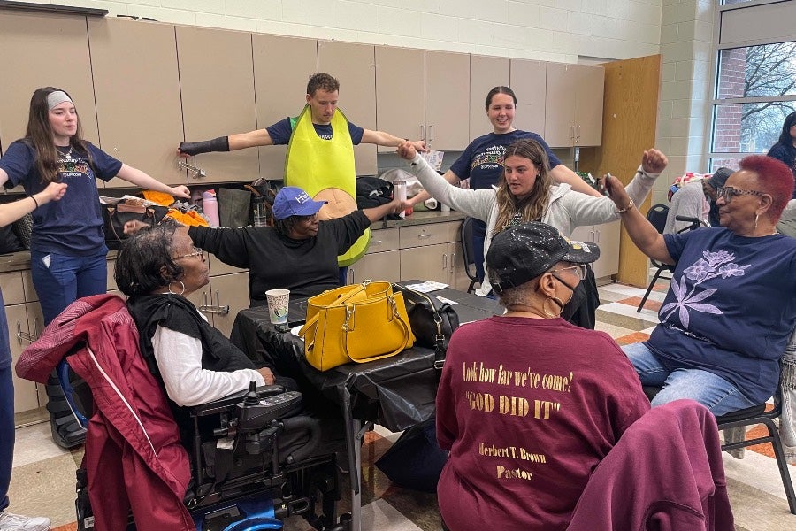 Nursing students interacting with the seniors at Hadley Park Community Center.