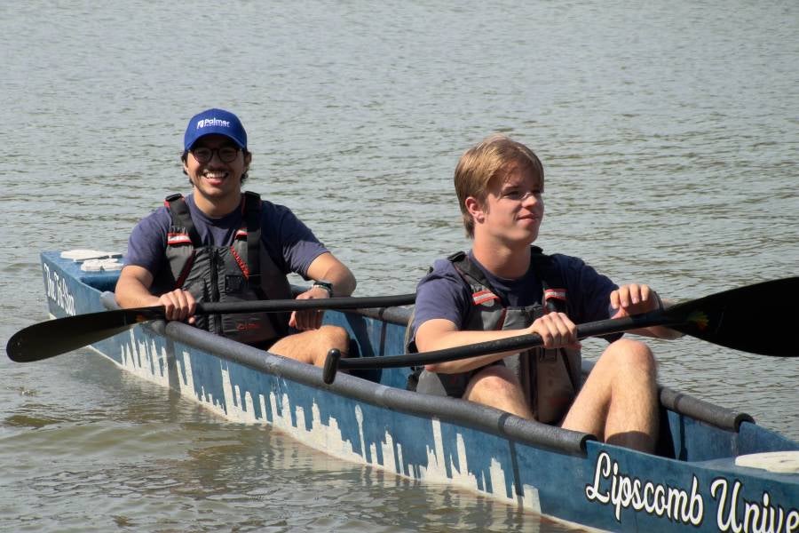 Students rowing in the concrete canoe