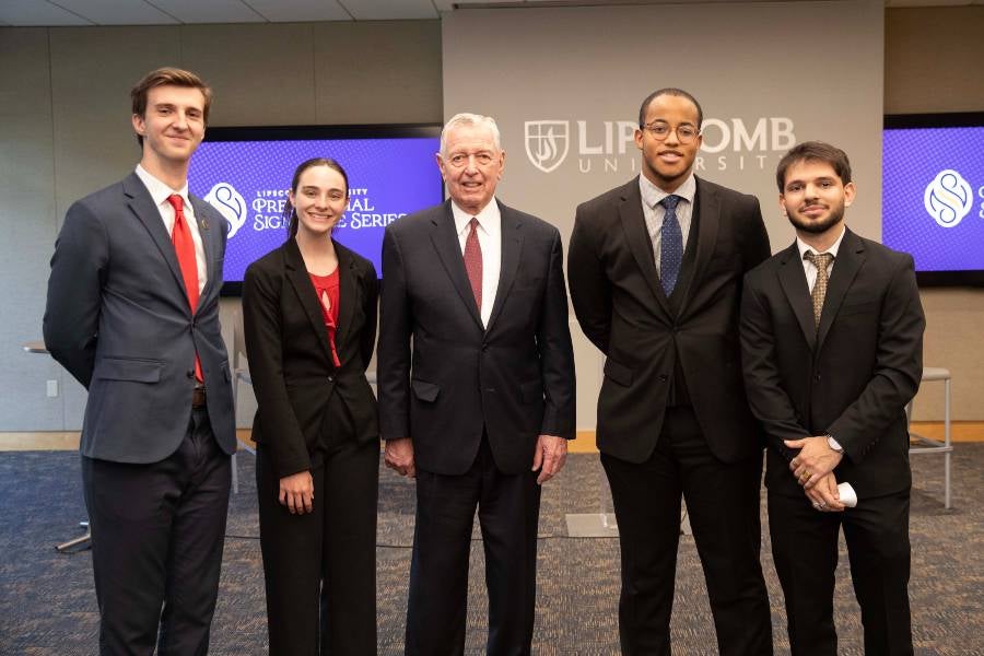 The 2025-26 Fred Gray Scholars with former U.S. Attorney General John Ashcroft at the Fred Gray Lecture on March 31. 