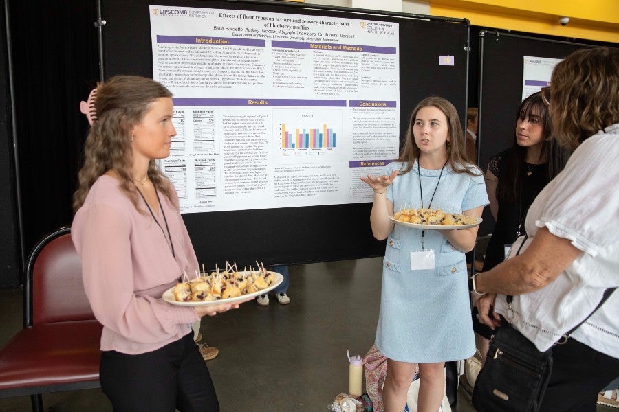 Nutrition students presenting their poster presentaion