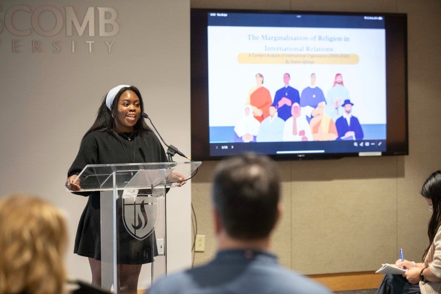 Ajiboye presenting at the Student Scholars Symposium