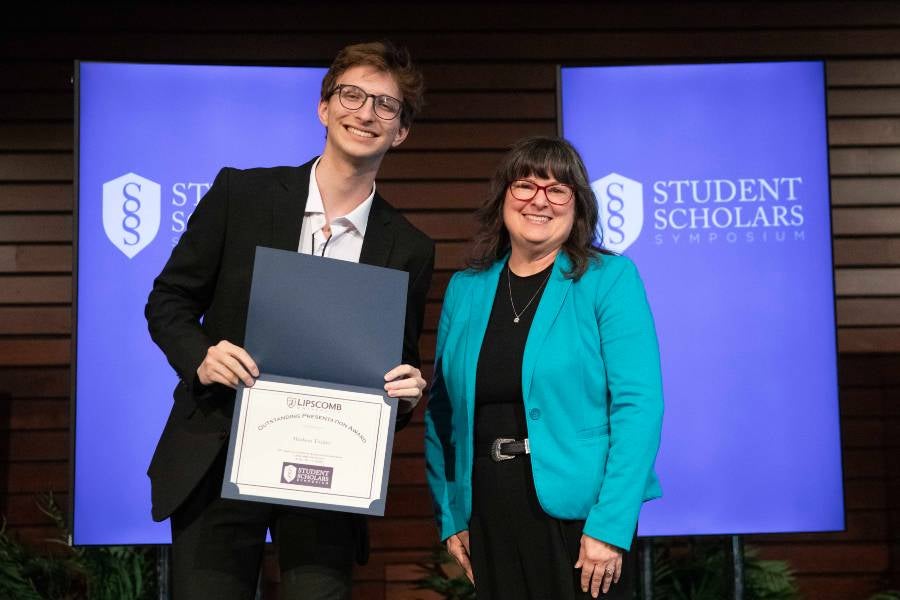 Hudson Tucker receives and outstanding presentation award for the Student Scholars Symposium