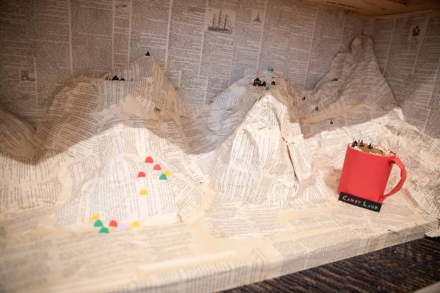 Paper mountains with cup of hot chocolate