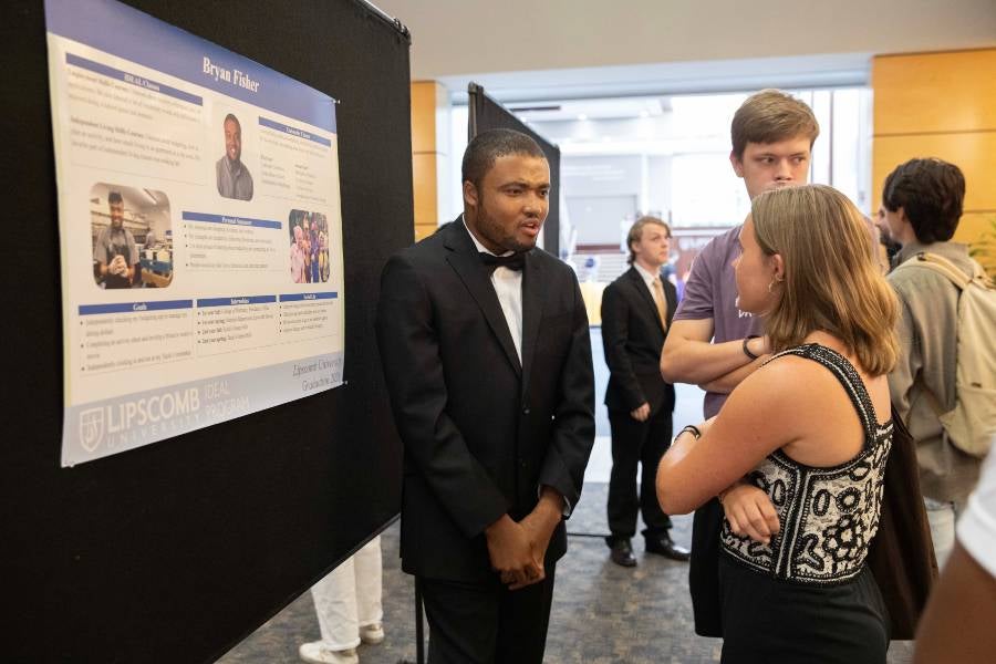 Student presenting poster