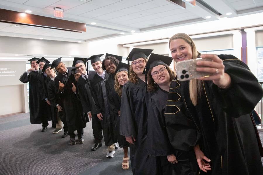 IDEAL graduates take a selfie with Halle King