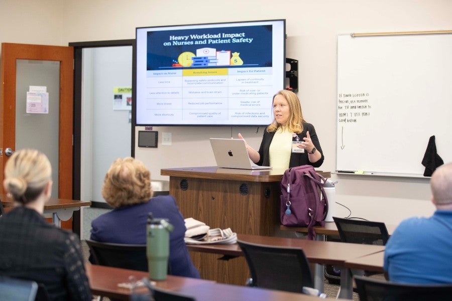 Jenna Sissom apeakign to Lipscomb faculty about AI use in nursing