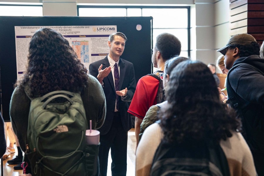 Josh Owens presenting to students on Faculty Research Day