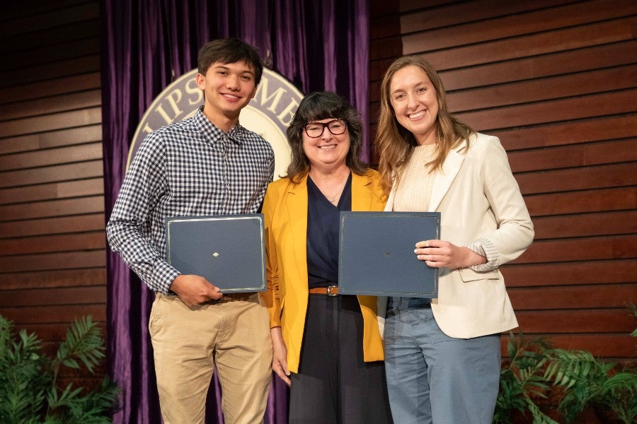 Kai Lam and Ellie Griner receiving a Student Scholars Symposium honor in 2025
