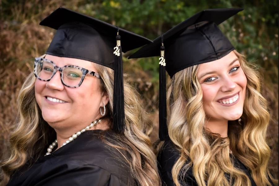 Christina and Carleigh Martin in their caps and gowns. 