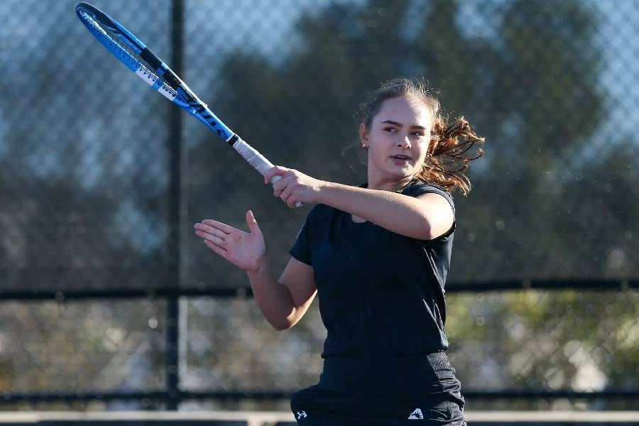 Sofiia Paladi playing tennis. 