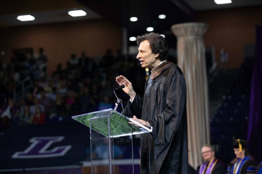 Steve Taylor, Imagine House executive director and associate professor of cinematic arts, gave the charge during undergraduate commencement. 