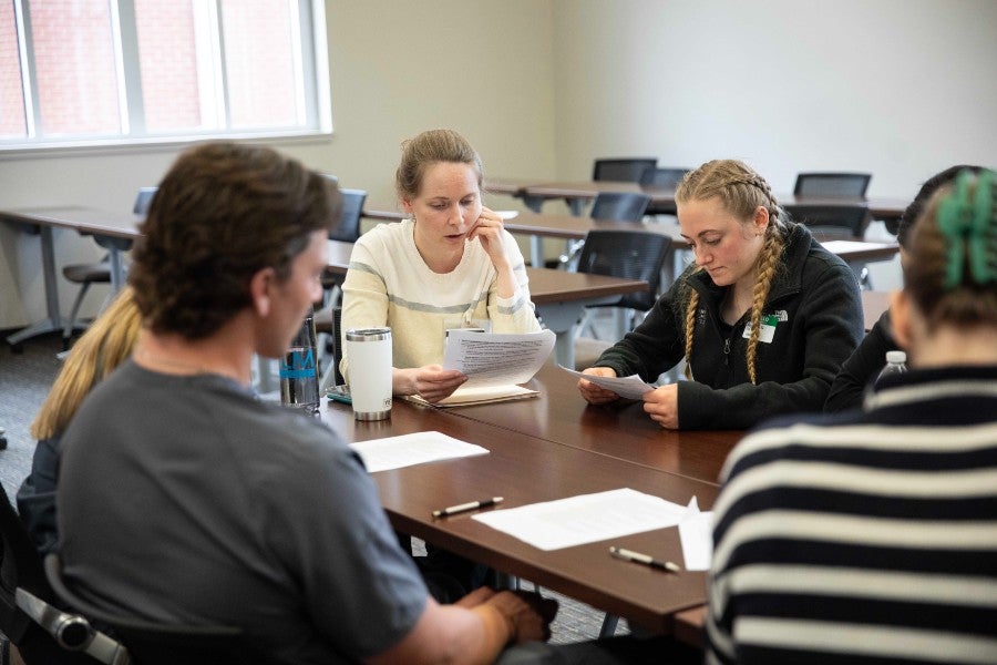 students discussing the best discharge plan for a mock patient