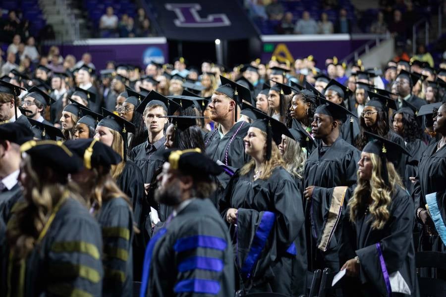 Lucas Landis, center, at commencement in May. 