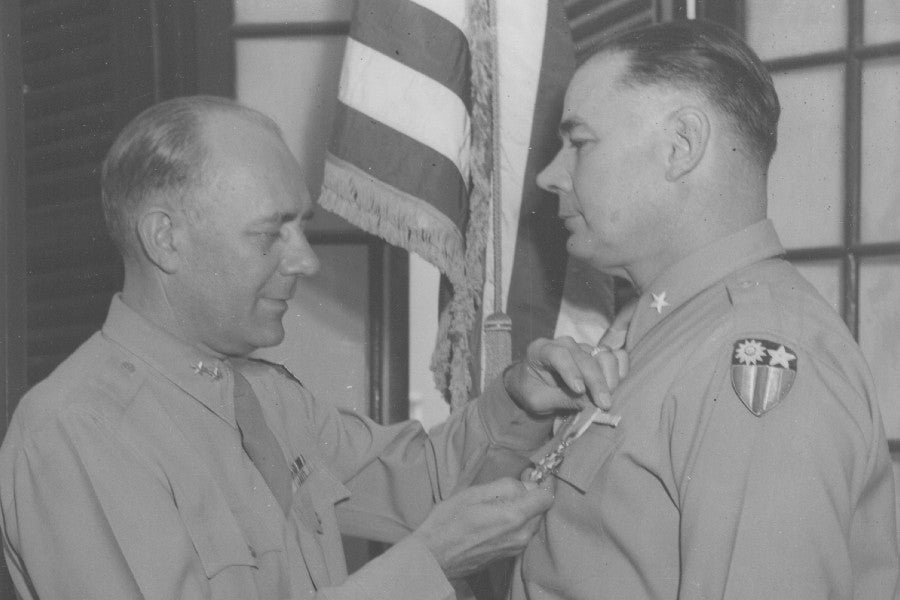 Neyland receiving a military medal