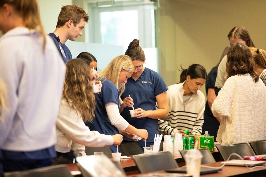 students preparing food for patients with swallowing disorders