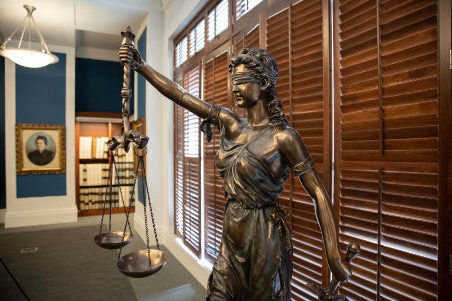statue of justice in the Metro Archives legal room