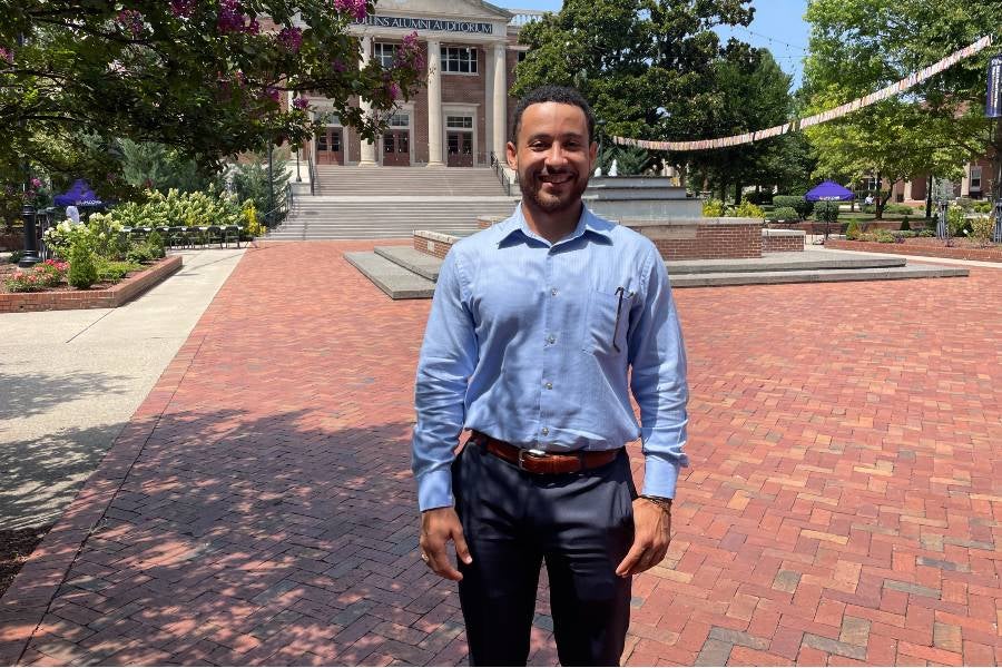 Kaleb Bellew standing in Bison Square. 