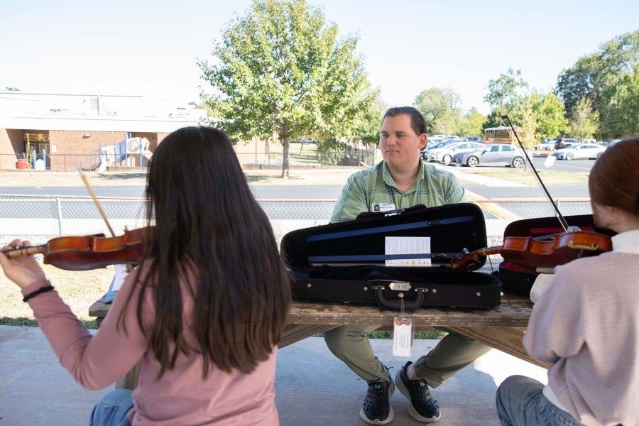 Ben Beard at J.T. Moore School working with students