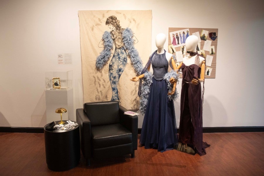 Reagan Sander's third-place winning design (at right) and Danalyn Damaska's artwork at the October exhibit.