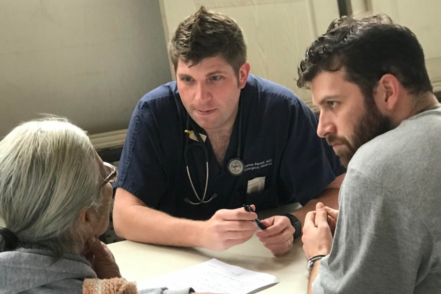 Dr. James Parnell talking with a patient on a mission trip in Baja, Mexico
