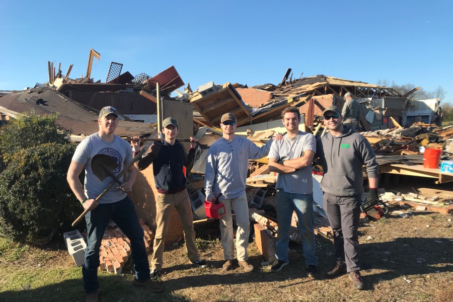 Lipscomb students working at a tornado demolished home in Nashville