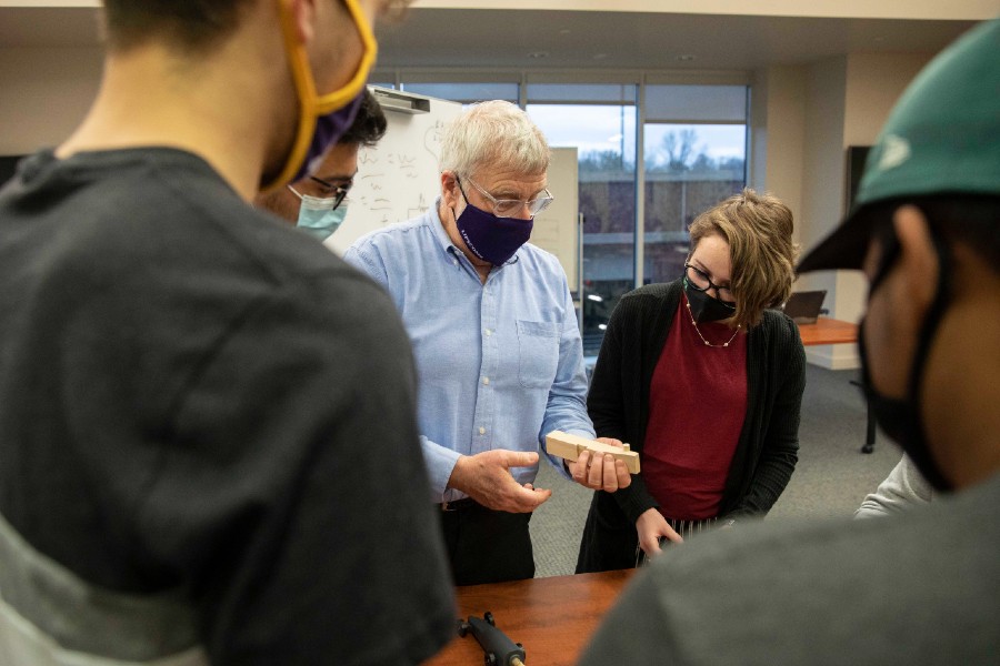 Professor Fort Gwinn helps students with their derby cars