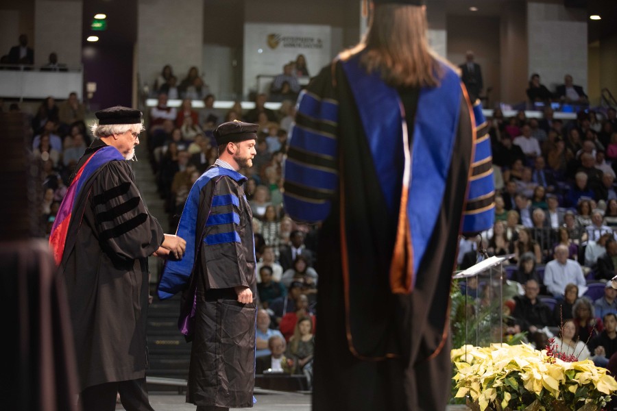 The awarding of PhD hoods at Lipscomb graduation