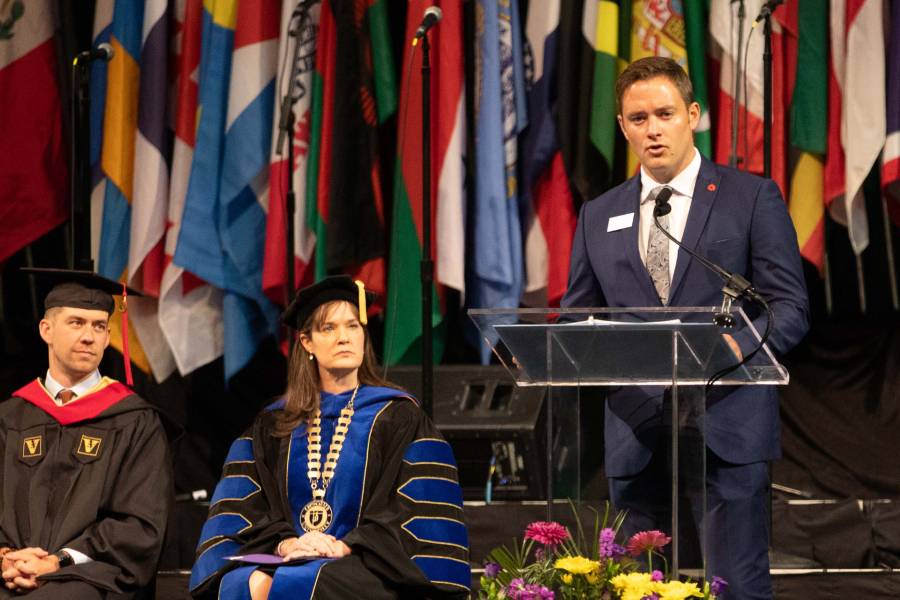 Ryan Anderson reads scripture at President's Convocation. 