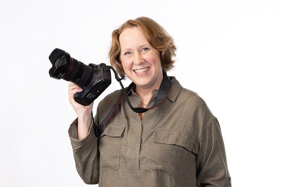 Portrait of Kristi Jones with camera