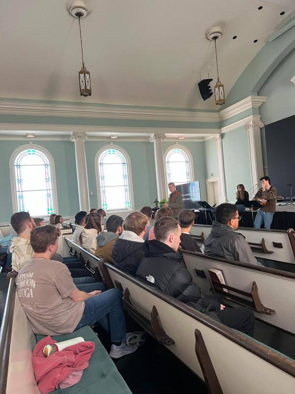 Pastoral Leadership students sit in pews at their annual retreat