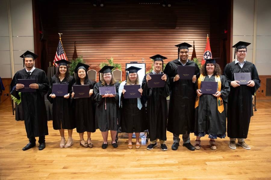 IDEAL program graduates with diplomas. 