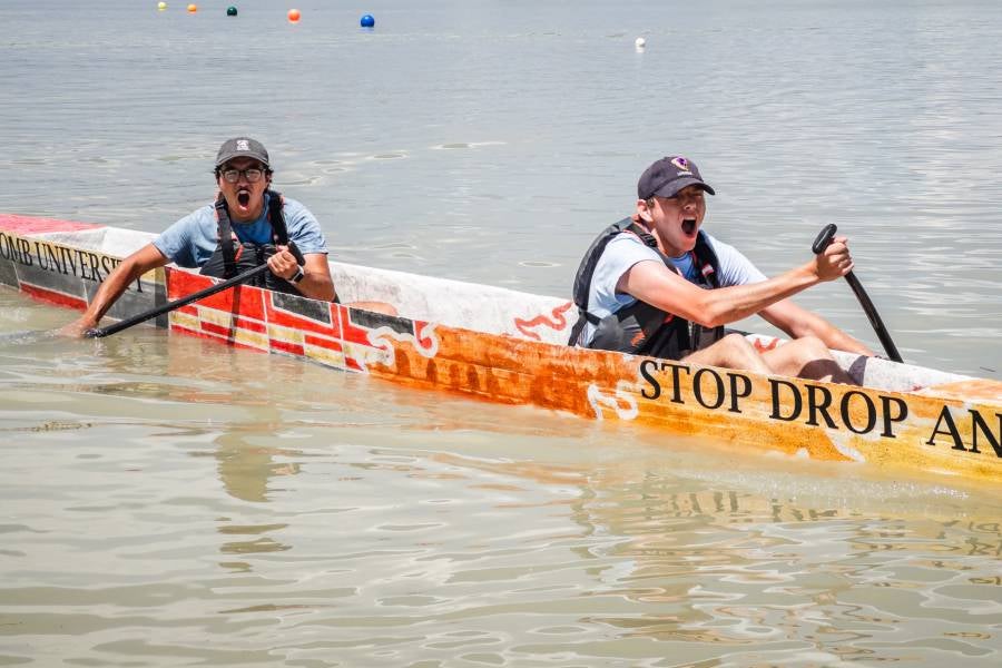 Jackson Stephens rowing in the concrete canoe