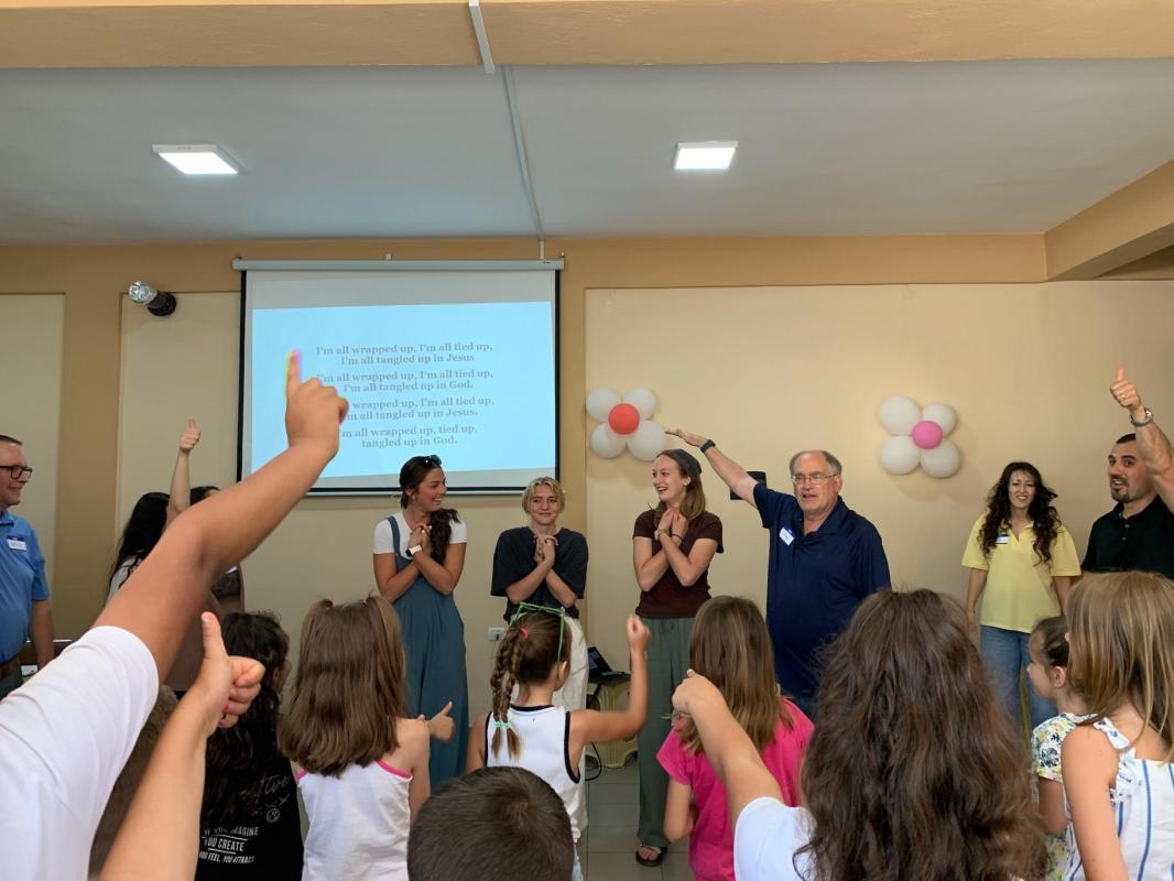 Albanian children cheering during VBS