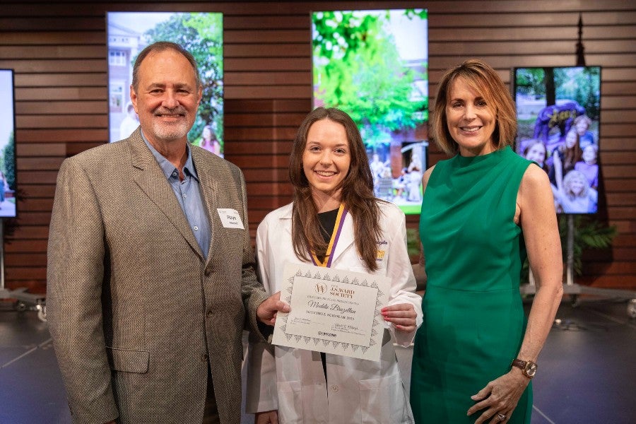 Raye and Elisa Mitchell with the winner of their funded scholarship Maddie Brazelton