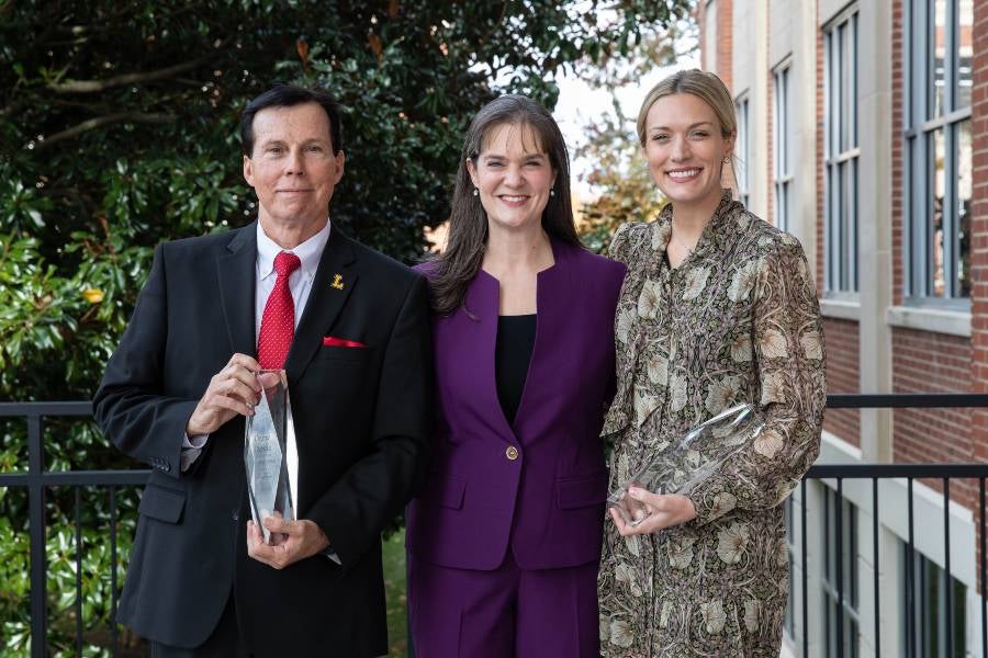 Lipscomb President Candice McQueen with the 2025 top alumni award honorees Drew Davis (’81) and Alex Samuels (’11).